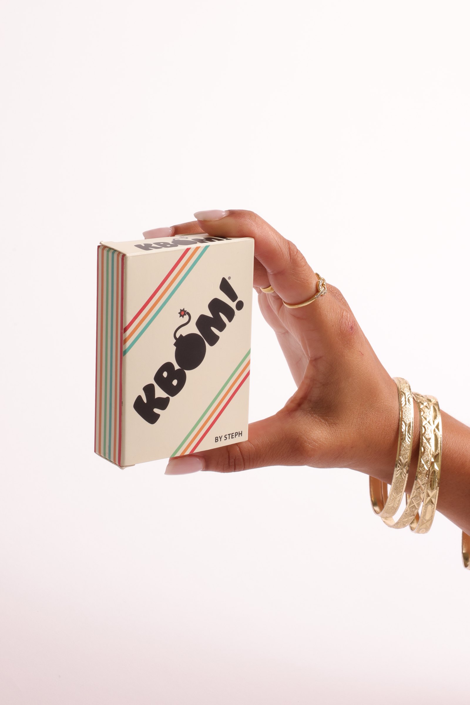 KBÓM cream waterproof deck box held in a hand